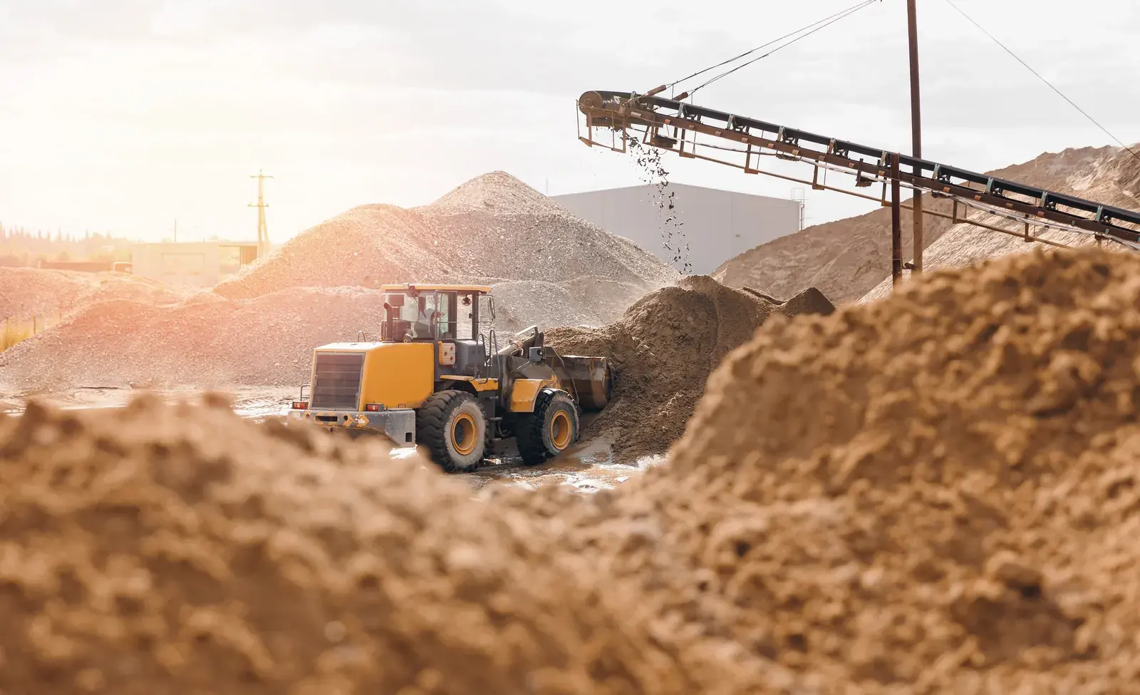 Quarry with conveyors and gravel stockpiles